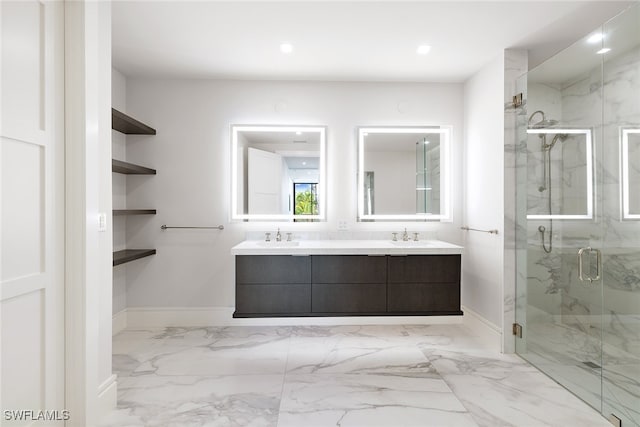 bathroom with built in shelves, a shower with shower door, and vanity