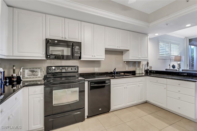 kitchen with sink, black appliances, and white cabinets