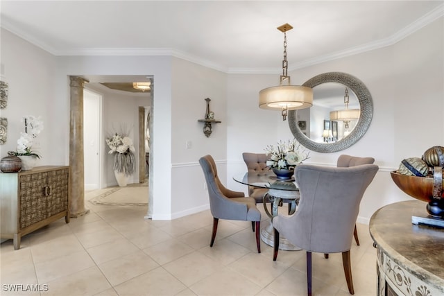 dining area with crown molding, light tile patterned flooring, and decorative columns