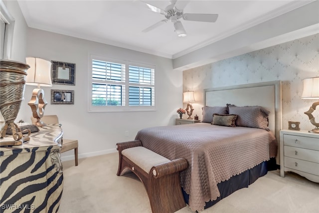 carpeted bedroom featuring crown molding and ceiling fan