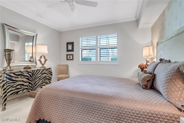 bedroom featuring ornamental molding, carpet flooring, and ceiling fan