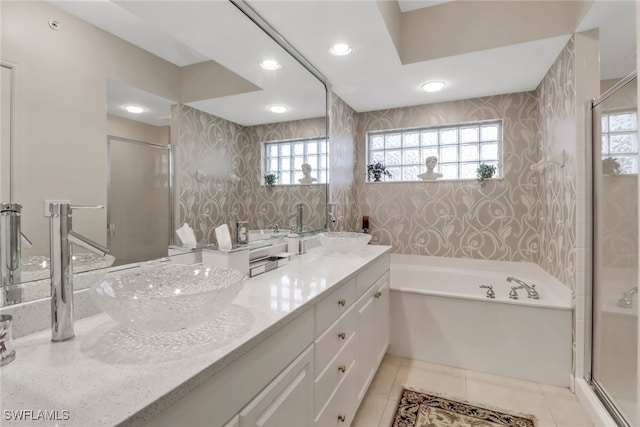 bathroom with vanity, shower with separate bathtub, and tile patterned flooring