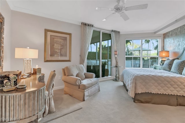 carpeted bedroom with ceiling fan, access to outside, and ornamental molding