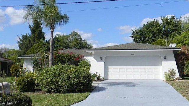 ranch-style house featuring a garage