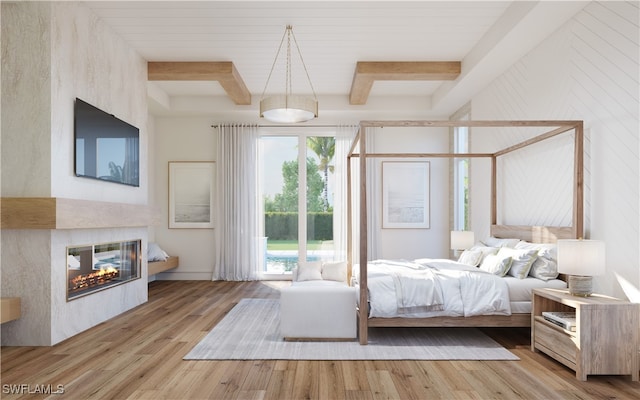 bedroom with beam ceiling and light hardwood / wood-style flooring