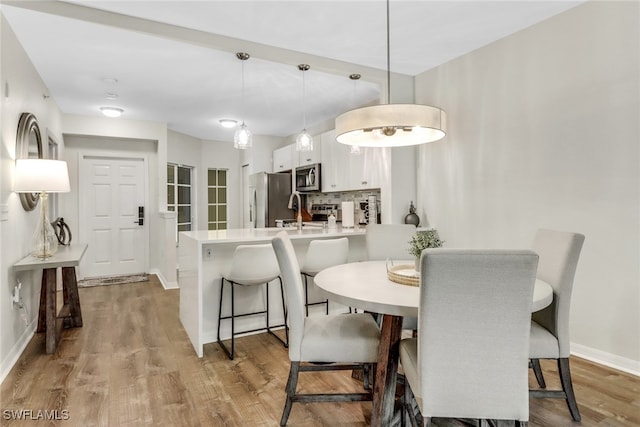 dining area featuring light hardwood / wood-style floors