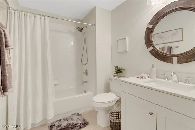 full bathroom featuring tile patterned floors, shower / tub combo with curtain, vanity, and toilet