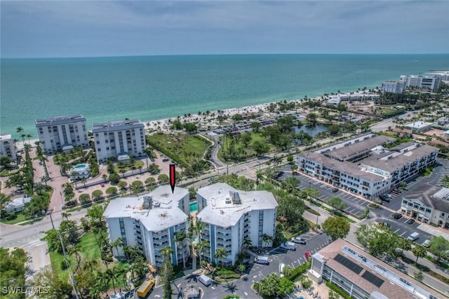 drone / aerial view featuring a water view and a city view