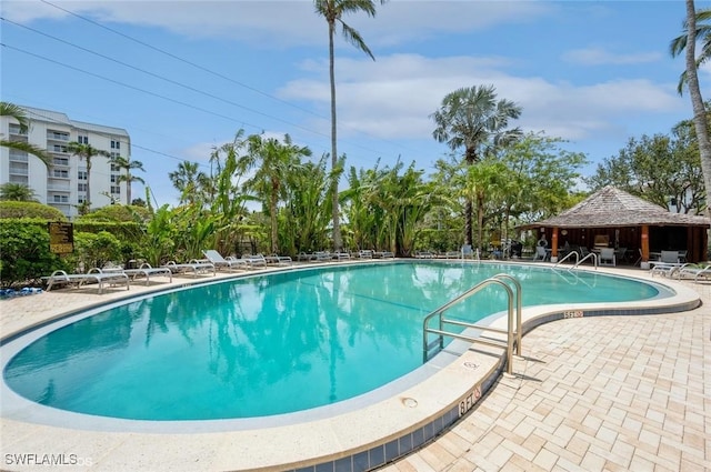 pool featuring a gazebo and a patio area