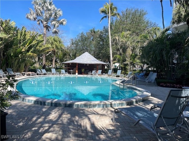 pool featuring a patio area and a gazebo