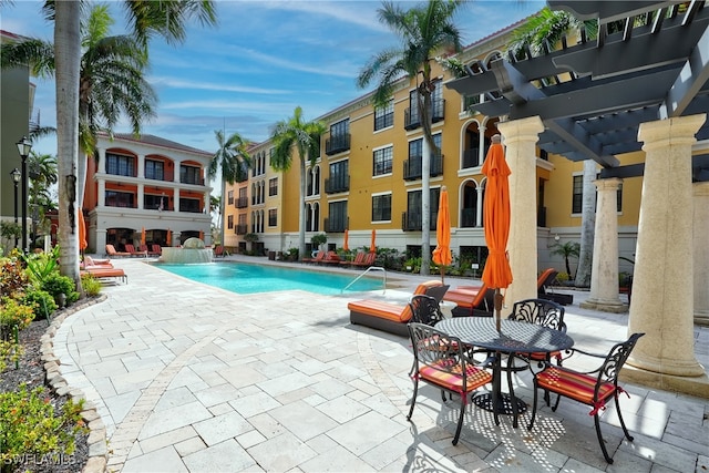 view of swimming pool featuring a pergola, a patio area, and pool water feature