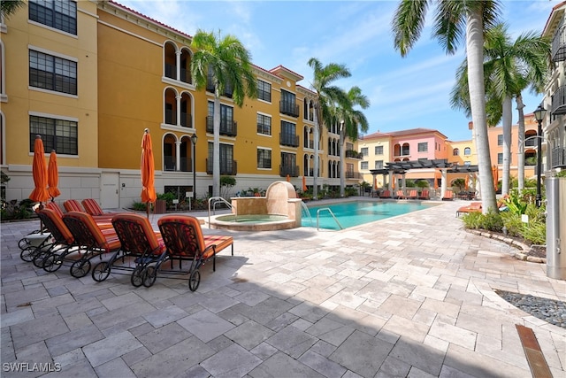 view of pool featuring a patio area and a pergola