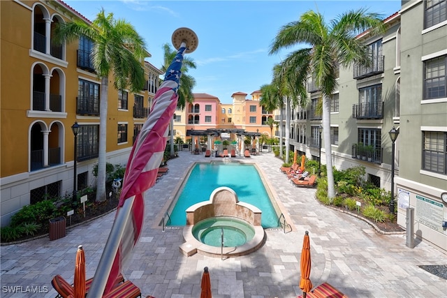 view of pool featuring a hot tub