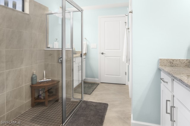 bathroom with vanity and walk in shower