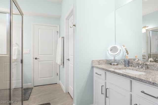 bathroom featuring vanity and walk in shower