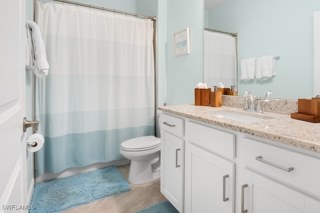 bathroom featuring vanity, toilet, a shower with shower curtain, and tile patterned flooring