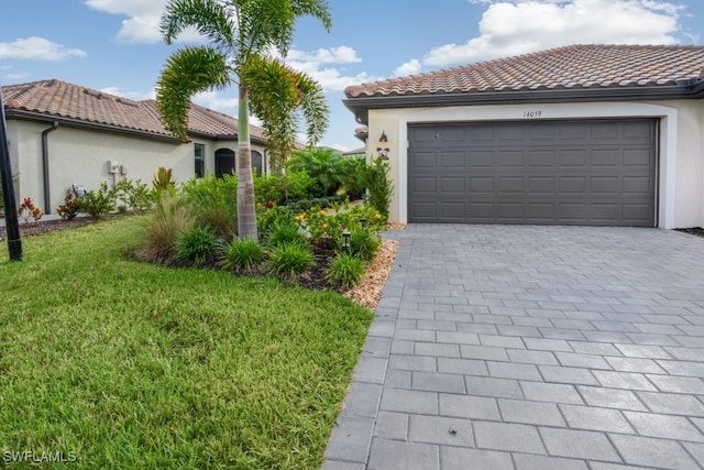 exterior space featuring a front yard and a garage