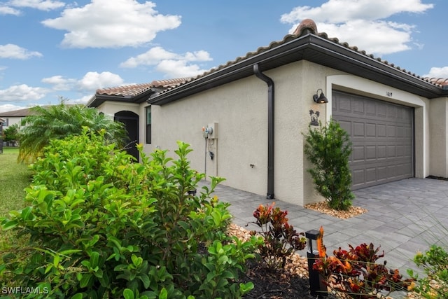 view of property exterior featuring a garage