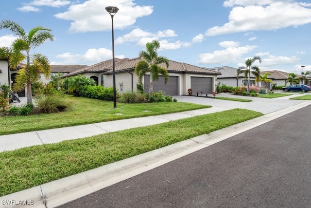 view of front of house with a front lawn and a garage