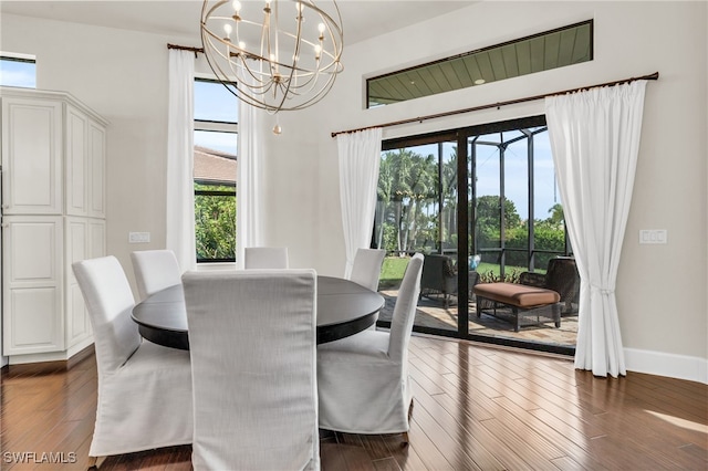 dining room featuring a chandelier and dark hardwood / wood-style flooring