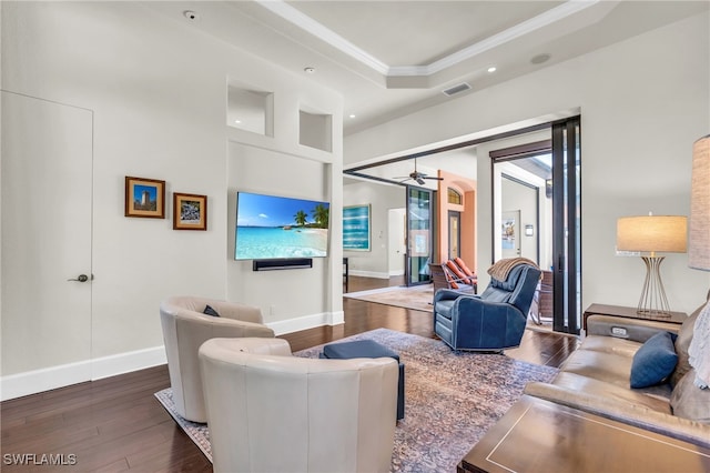 living room with ceiling fan and dark hardwood / wood-style floors