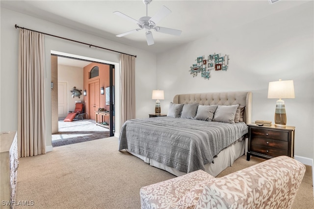 bedroom with light carpet and ceiling fan