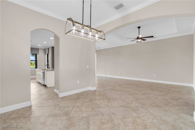 unfurnished room featuring crown molding, sink, light tile patterned floors, and ceiling fan