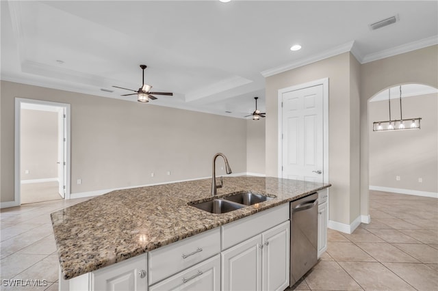 kitchen featuring white cabinets, a center island with sink, sink, and stainless steel dishwasher