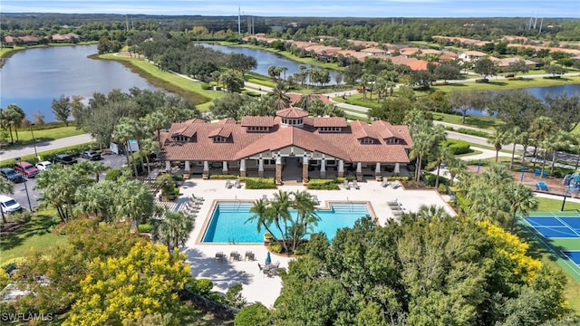 birds eye view of property with a water view