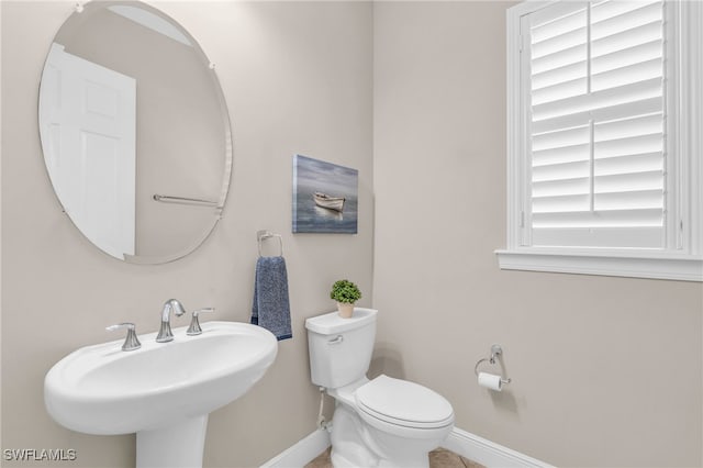 bathroom featuring sink and toilet