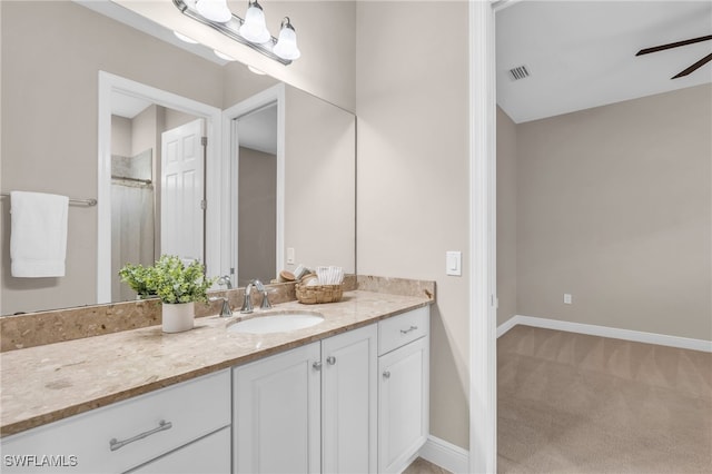 bathroom featuring ceiling fan and vanity