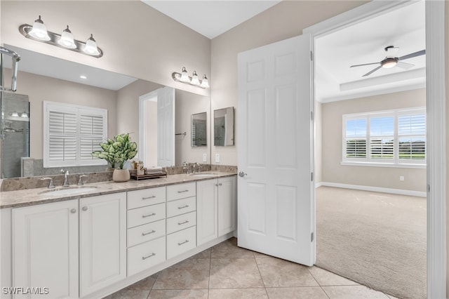 bathroom featuring ceiling fan, tile patterned flooring, and vanity