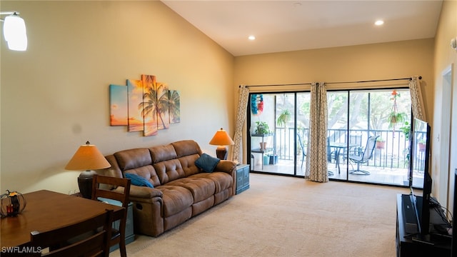 carpeted living room with lofted ceiling