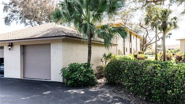 view of side of property with a garage