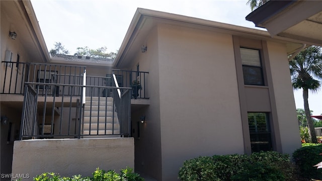 view of home's exterior with a balcony