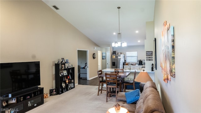 living room with high vaulted ceiling and wood-type flooring