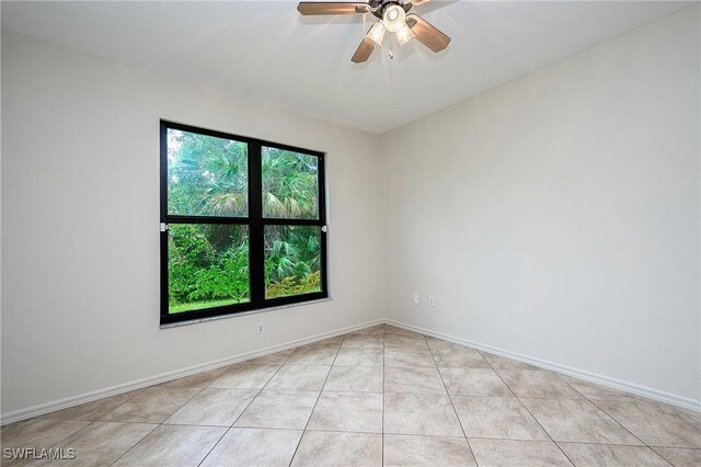 7670 Meadow Lakes Dr Unit 1501, Naples, FL 34104 - empty room featuring a ceiling fan, baseboards, and light tile patterned floors