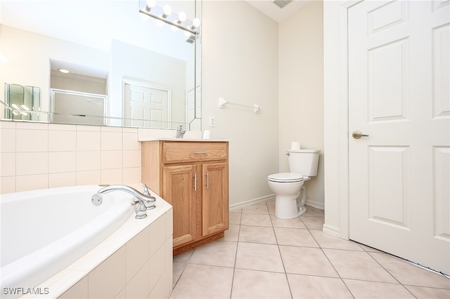 full bathroom with tile patterned floors, toilet, vanity, and independent shower and bath