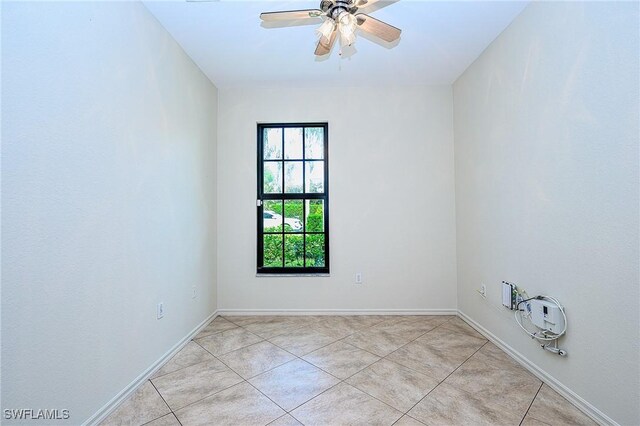 7670 Meadow Lakes Dr Unit 1501, Naples, FL 34104 - spare room featuring baseboards and ceiling fan