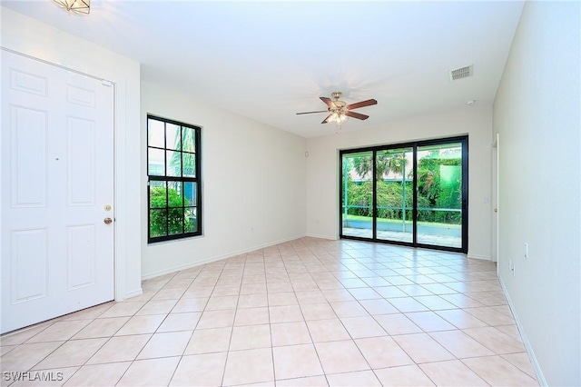 7670 Meadow Lakes Dr Unit 1501, Naples, FL 34104 - unfurnished room with a healthy amount of sunlight, baseboards, ceiling fan, and visible vents