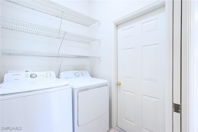 7670 Meadow Lakes Dr Unit 1501, Naples, FL 34104 - washroom featuring washer and clothes dryer and laundry area