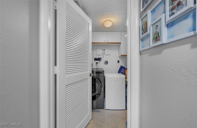 washroom with a textured ceiling