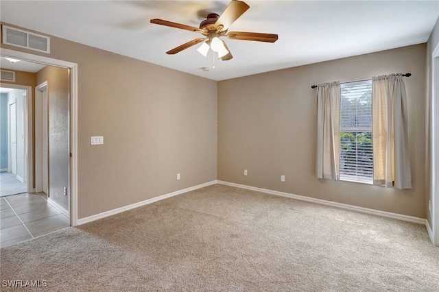 carpeted empty room with ceiling fan