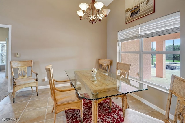 dining area featuring a notable chandelier and light tile patterned floors