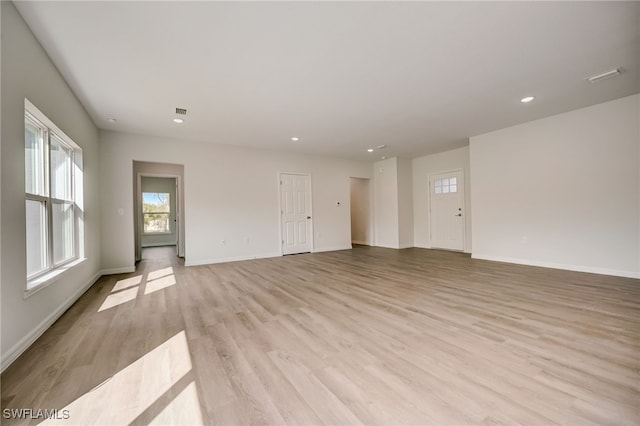 unfurnished room featuring light wood-type flooring