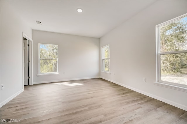 empty room with light hardwood / wood-style floors