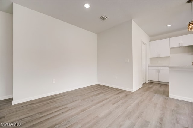 unfurnished living room featuring light hardwood / wood-style floors