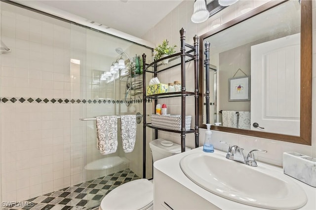 803 River Point Dr Unit 306B, Naples, FL 34102 - bathroom featuring vanity, toilet, and a stall shower