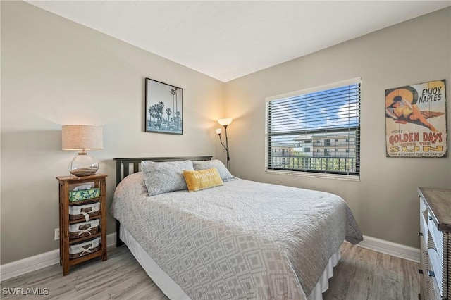 803 River Point Dr Unit 306B, Naples, FL 34102 - bedroom with baseboards and light wood finished floors