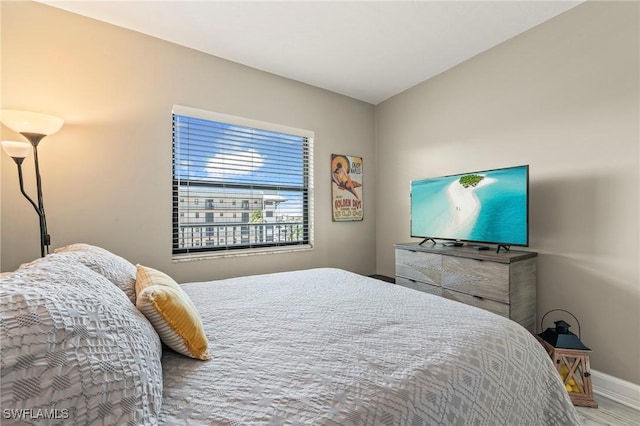 803 River Point Dr Unit 306B, Naples, FL 34102 - bedroom featuring baseboards